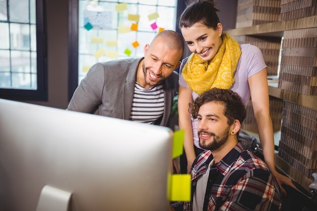 Business people looking at computer